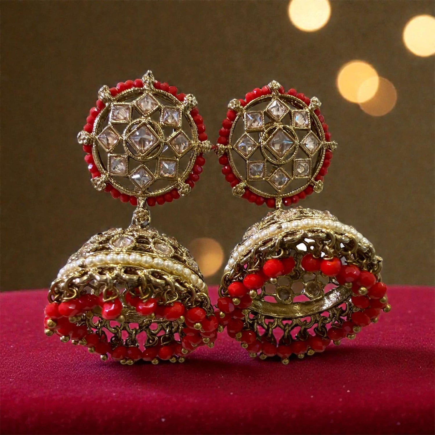 Dual-Tone Kundan Jhumkas: elegant jhumka earrings with geometric stone work and intricate gold detailing.