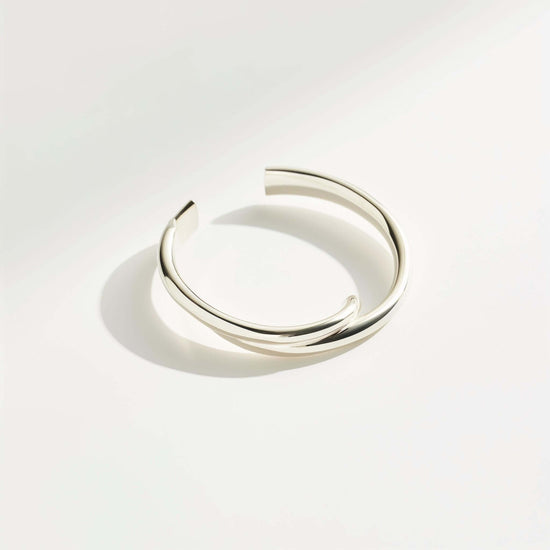 Elegant Silver Bangle showcasing a sleek design, perfect for any occasion and adding a touch of sophistication.