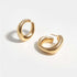 Gold Chunky Hoop Earrings displayed on a light background, showcasing their glossy finish and unique chunky design.